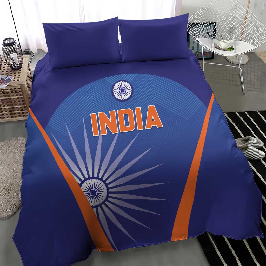 Blue India-themed duvet and pillow set with bold orange diagonal lines and sunburst graphic