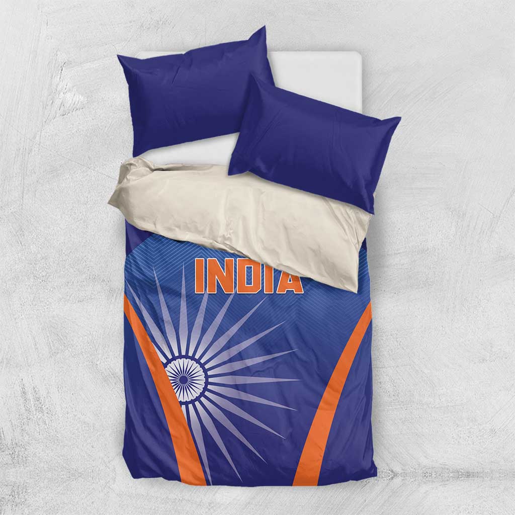 Blue and orange India-themed bedding set with fitted duvet, two blue pillows, one white pillow