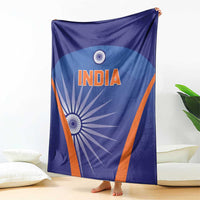 Blue cricket blanket draped vertically with centered INDIA logo and orange border