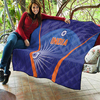 Blue quilt with orange V stripes, 'INDIA' text and white wheel motif on blue background