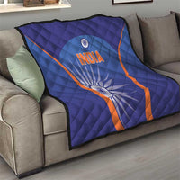 Blue India quilt on sofa with orange V trim, 'INDIA' and large wheel motif