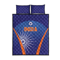 Blue quilt bed set with 2 matching pillows, large India text and sunburst graphic