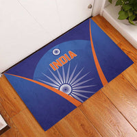 Blue India cricket rubber doormat angled on floor, orange border with INDIA and emblem