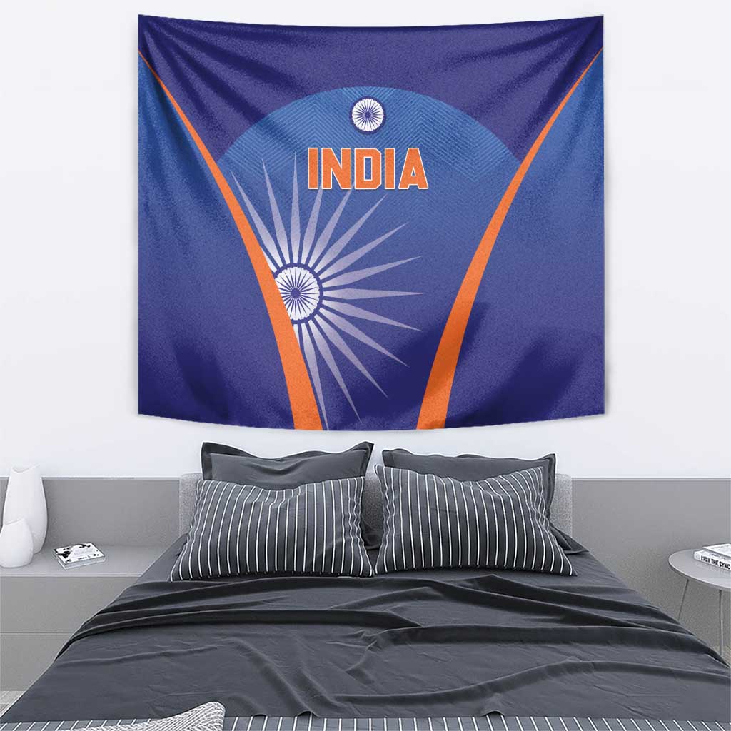 Blue India cricket tapestry on wall above bed, orange border and INDIA text