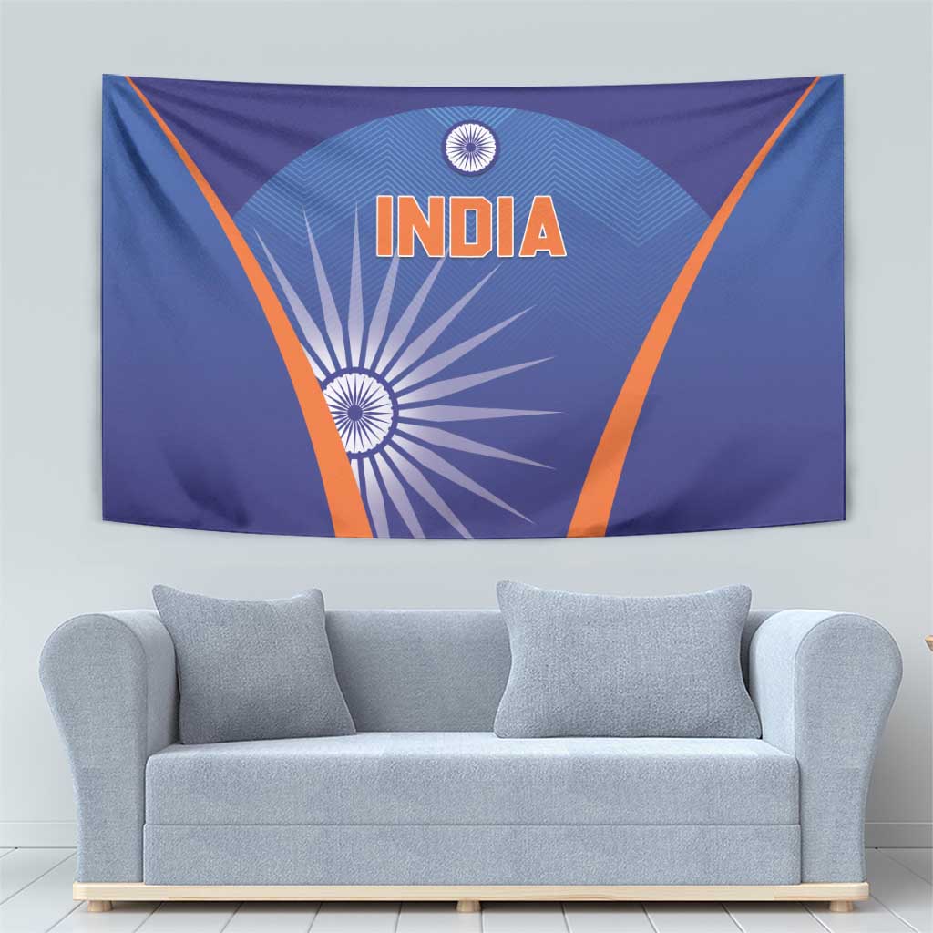 Blue India cricket tapestry above gray sofa, orange border and INDIA emblem