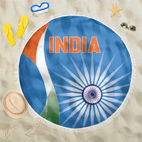 Round blue India beach blanket with fringe, featuring white tricolor and blue wheel