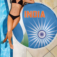 Round blue India beach blanket with fringe, INDIA text and tricolor chakra wheel by pool