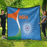 Blue cricket quilt blanket spread wide with India text, orange-white emblem, and green flag accent