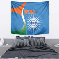 Blue India cricket wall tapestry with orange word INDIA, white wheel rays, and green accents.