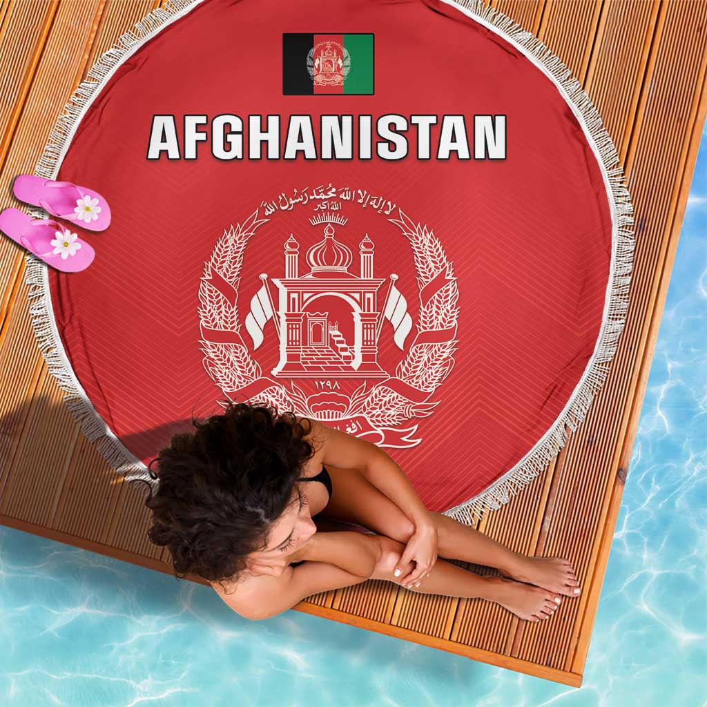 Red round Afghanistan beach blanket with white fringe and “AFGHANISTAN” headline with crest