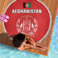 Red round Afghanistan beach blanket with white fringe and “AFGHANISTAN” headline with crest