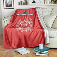 Red Afghanistan flag cricket blanket with white crest and “AFGHANISTAN”, draped on sofa