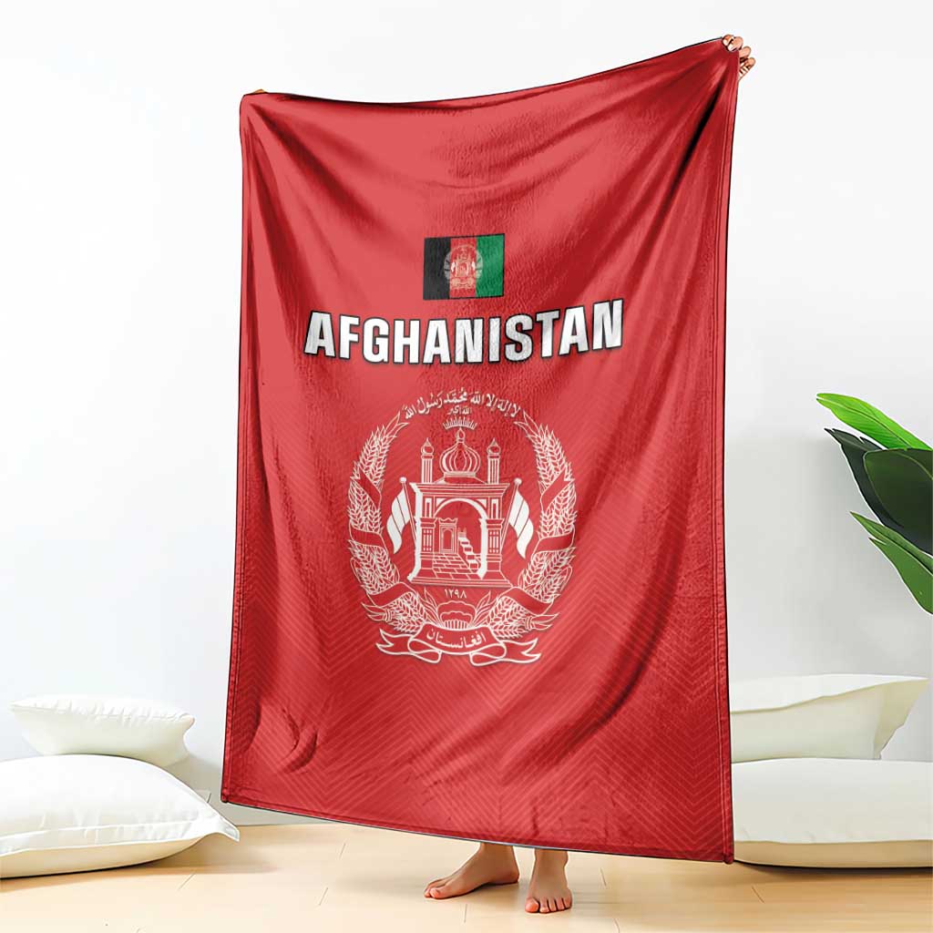 Red Afghanistan flag cricket blanket with white crest and “AFGHANISTAN”, hanging on stand