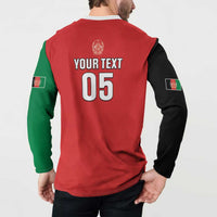 Back of red cricket sweatshirt with green/black sleeves, YOUR TEXT 05 crest print