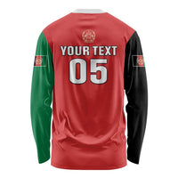 Red long-sleeve cricket shirt with “YOUR TEXT” and “05” on back, green and black sleeves.