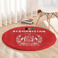 Red round rug showing Afghanistan flag-style emblem and 'AFGHANISTAN' text