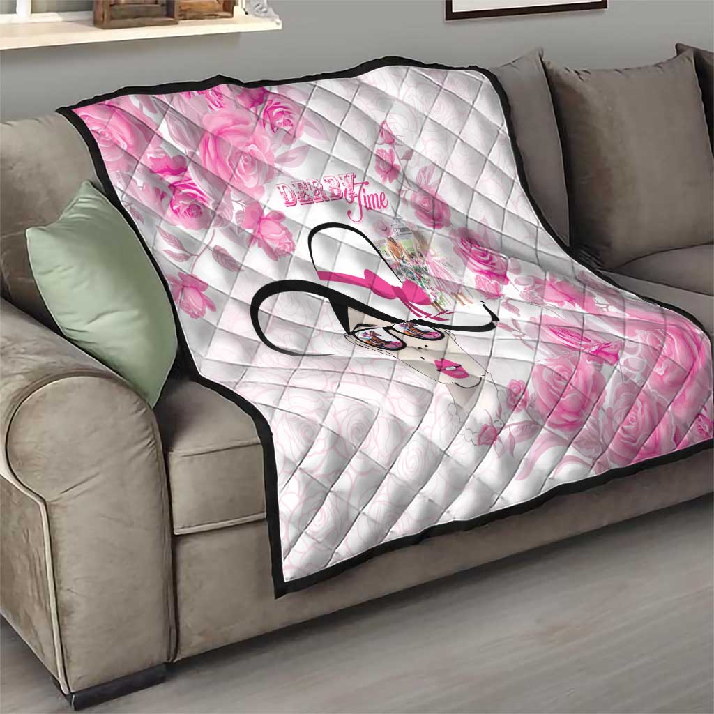 Pink floral quilt on sofa, diamond stitch pattern, stylized woman face graphic, black edge