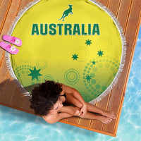 Round yellow beach blanket with green Australia text, star patterns, and white fringed border