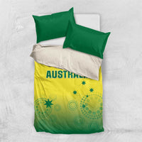 Top-down view of green and yellow bedding set with AUSTRALIA text and stars