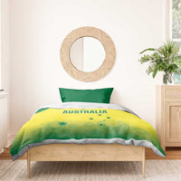 Yellow duvet with AUSTRALIA graphic and green side panels on a wooden bed