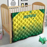 Australia cricket quilt blanket on wooden baby bed, green border and yellow 'AUSTRALIA'