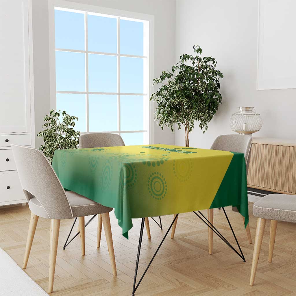 Green and yellow patterned cricket tablecloth draped over a dining table