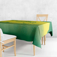 Corner view of green and yellow cricket tablecloth with decorative circular pattern