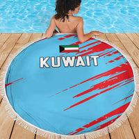 Round beach blanket, light blue with KUWAIT text and red pattern, white fringed border
