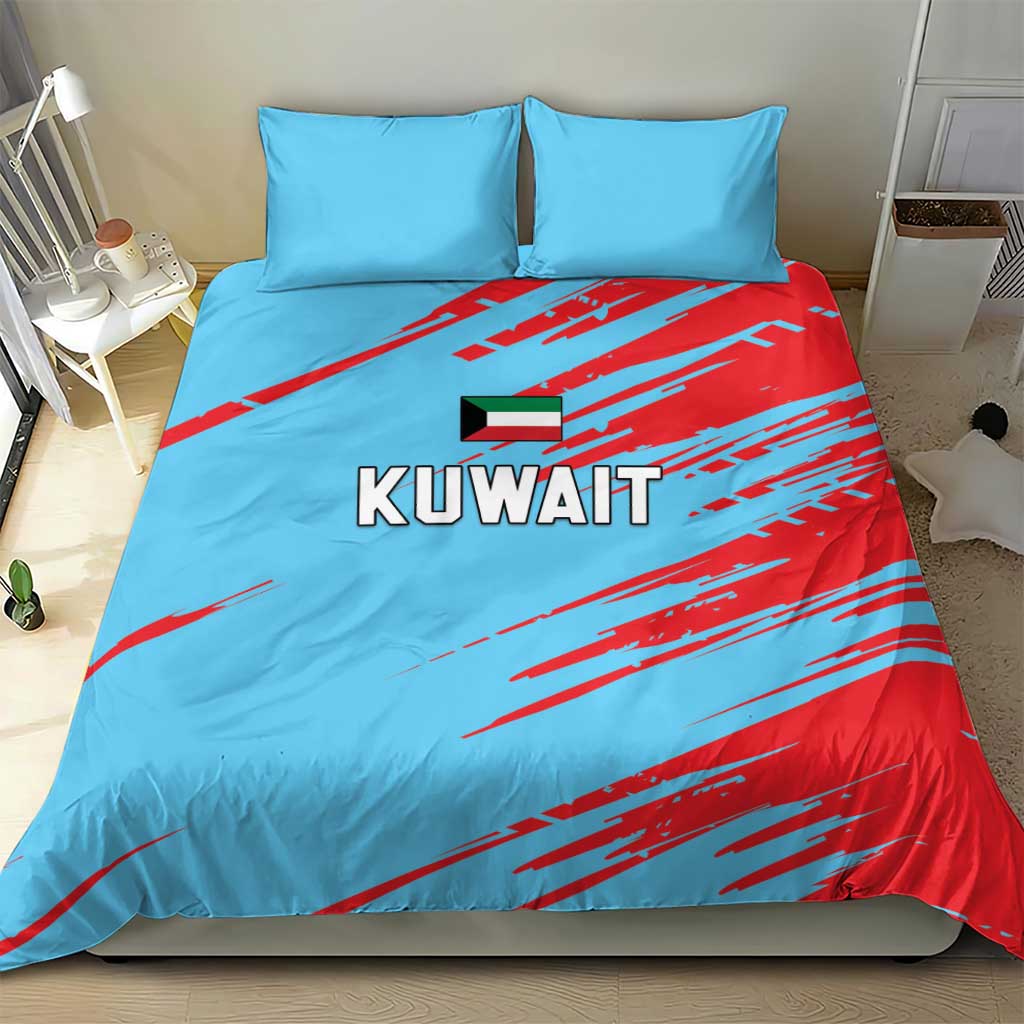 Blue duvet cover with KUWAIT text and red streak pattern, with two matching pillowcases.