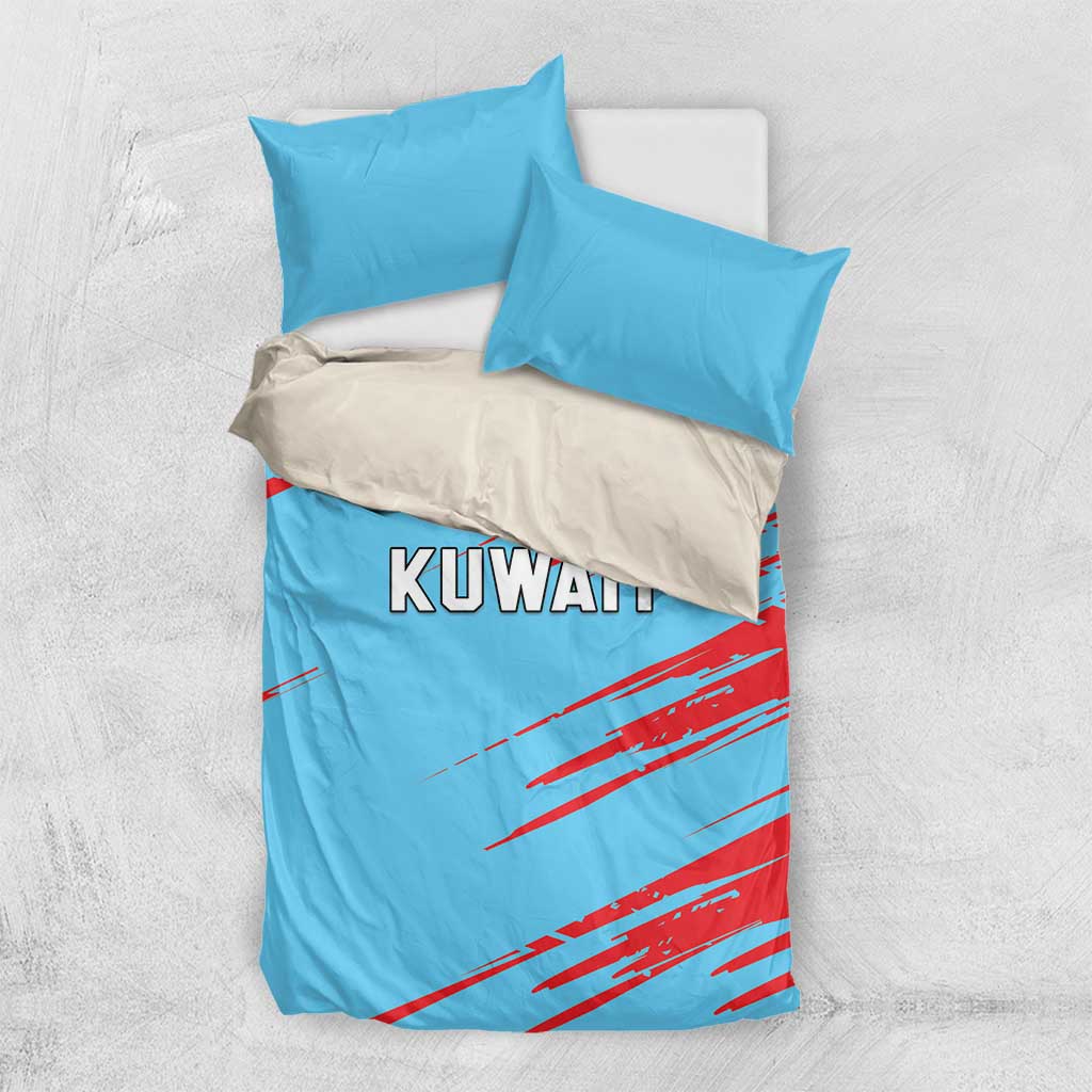 Light-blue duvet with KUWAIT logo and red streaks, paired with two blue pillowcases.