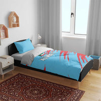 Blue and red Kuwait bedding set showing duvet cover and pillowcases on a bed.