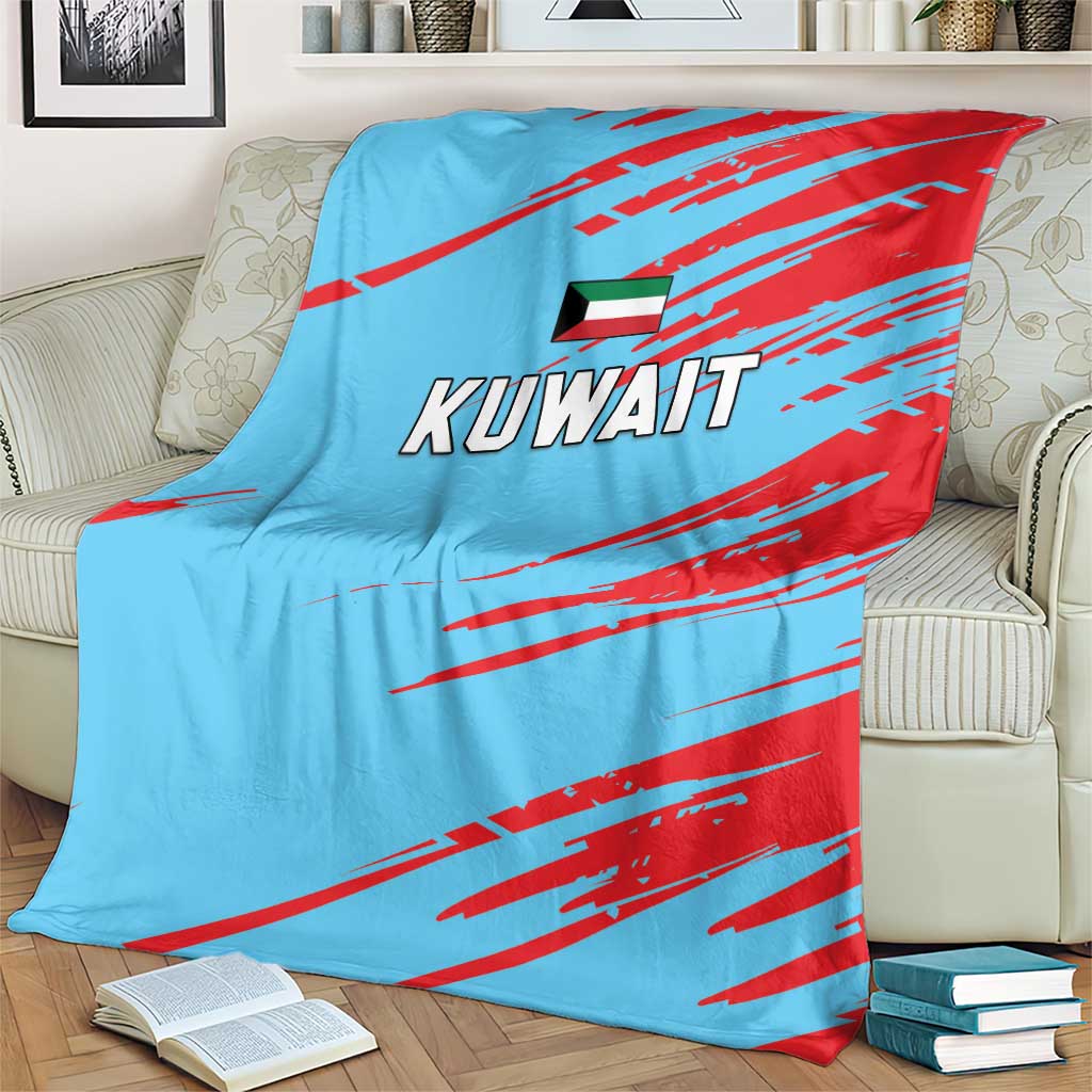 Light blue Kuwait cricket blanket with bold red diagonal streaks, Kuwait text, and flag emblem