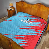 Kuwait cricket quilt on bed, blue and red diagonal stripe design with Kuwait lettering.