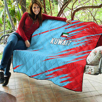 Kuwait cricket quilt on couch, blue and red diagonal stripes with centered Kuwait lettering.