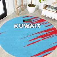 Round blue rug with red stripes and a KUWAIT logo design, circular stitched edge