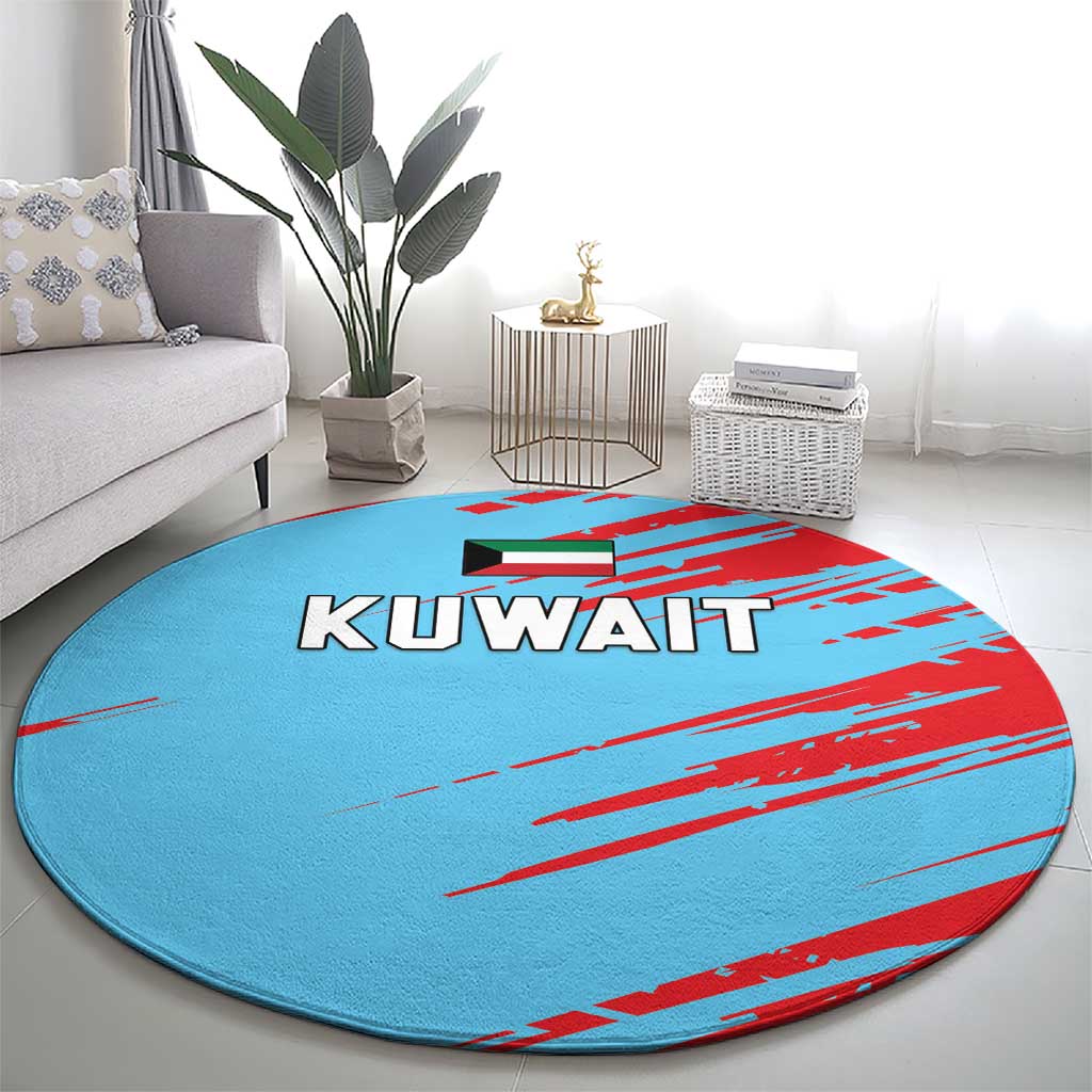 Round blue rug with red stripe graphics and KUWAIT lettering, centered in a living space
