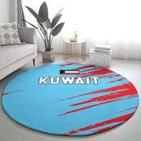 Round blue rug with red stripe graphics and KUWAIT lettering, centered in a living space