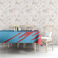 Blue and red Kuwait graphic tablecloth on dining table with bold diagonal stripe design