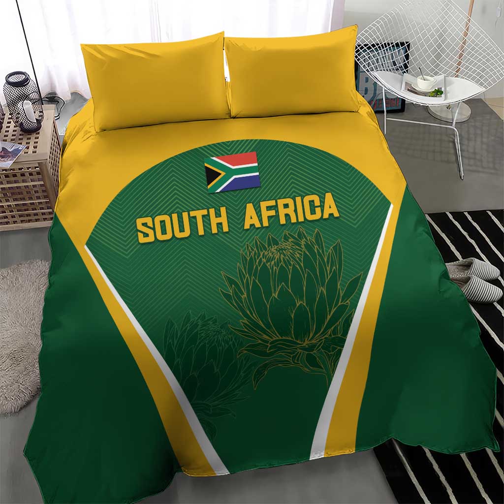 South Africa cricket bedding set on bed: green duvet with yellow border and two pillows