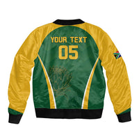 Unisex green cricket bomber jacket back with 'YOUR TEXT 05' and ribbed hem