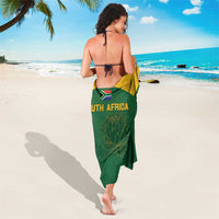 Green sarong with South Africa text and leaf-style graphic pattern