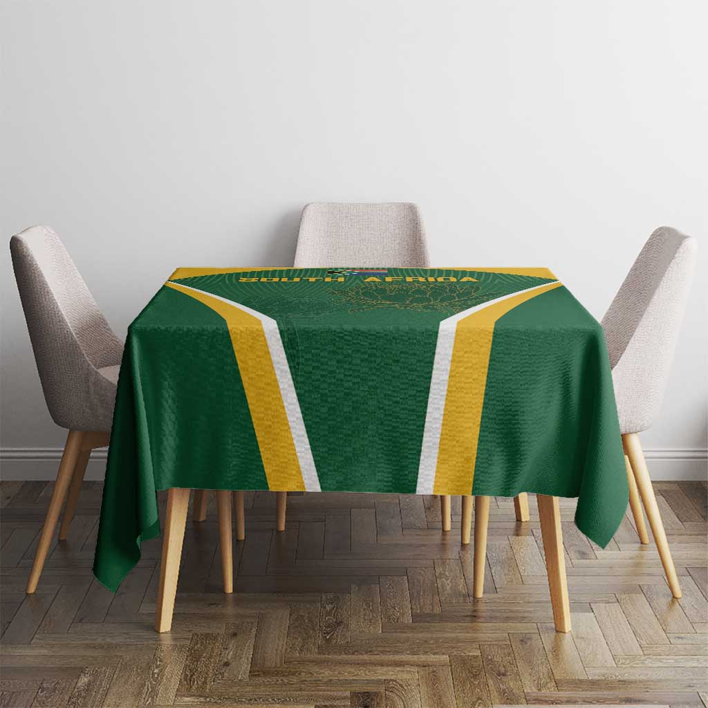 Green tablecloth with yellow stripe panels and central South Africa protea emblem on chairs