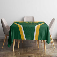 Green tablecloth with yellow stripe panels and central South Africa protea emblem on chairs