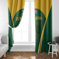 Green South Africa window curtains with gold trim and diagonal border; Protea graphic panels.
