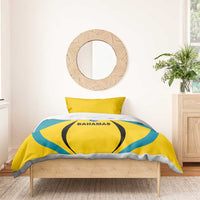Football bedding set with yellow and teal duvet, Bahamas logo, and ruffled gray top