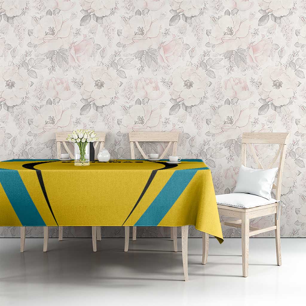Bahamas football tablecloth on table with yellow center panel and teal diagonal borders.