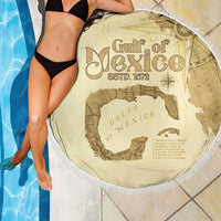 Beige round beach blanket with white fringe, Gulf of Mexico map graphic, fringed edge