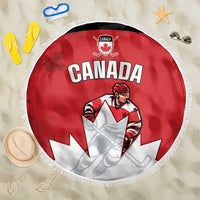 Red round beach blanket with Canada hockey player graphic and white fringe