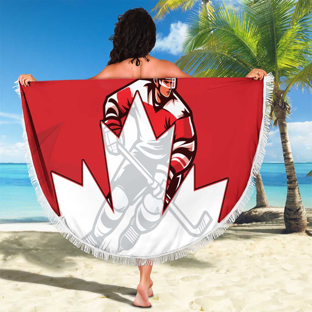 Red round beach blanket held up like a wrap, featuring Canada hockey player and white fringe