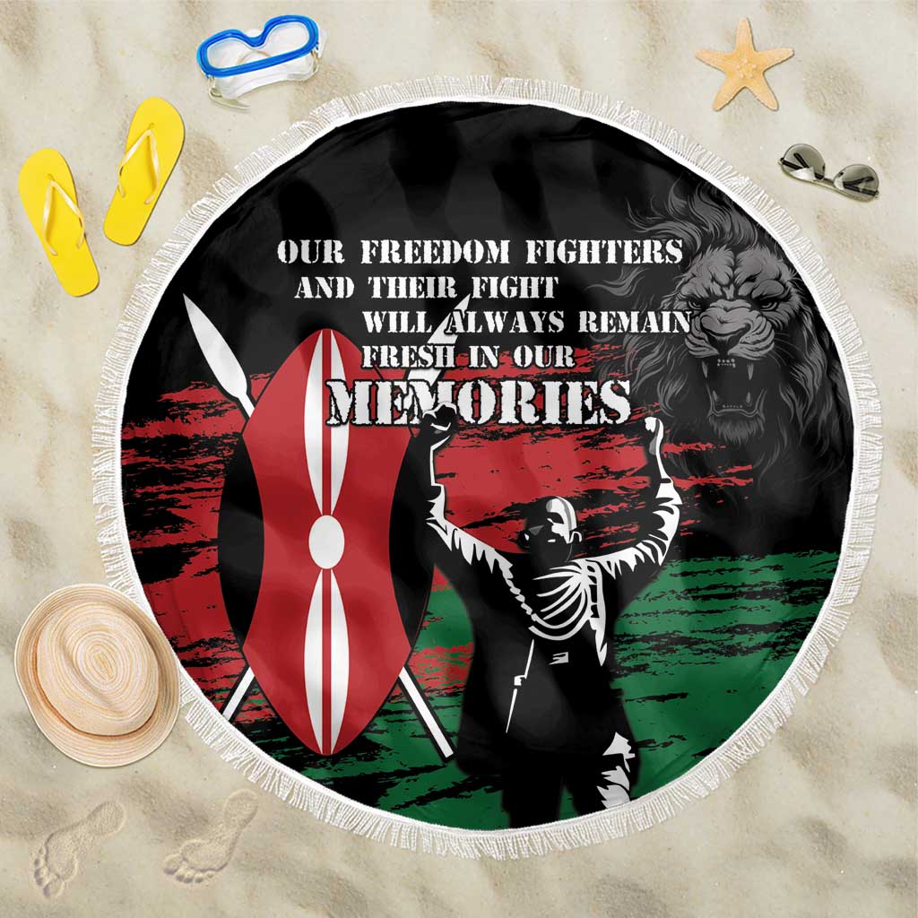 Black round beach blanket with fringe edge, red-green memorial warrior graphic and text.